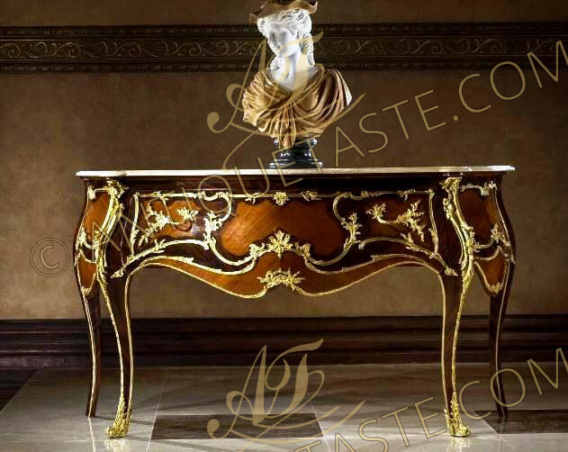 A stupendous French Louis XV style ormolu-mounted veneer inlaid freestanding console cabinet after the model by Joseph Emmanuel Zwiener Circa 1880, the eared serpentine shaped beveled marble top above the conforming frieze large drawer ornamented with fine chiseled and burnished foliate C scrolled ormolu mounts of acanthus leaves, two foliate ormolu handles, the sans traverse veneer inlaid sides adorned with the same ormolu mount scrolled ornamentation, Raised on cabriole legs shouldered with large ormolu leafy chutes and wrap around ormolu foliate sabots. The bottom frieze bordered to the contour with scrolled ormolu filet and foliate works